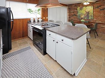 Beautiful brick accent wall in kitchen / dining area